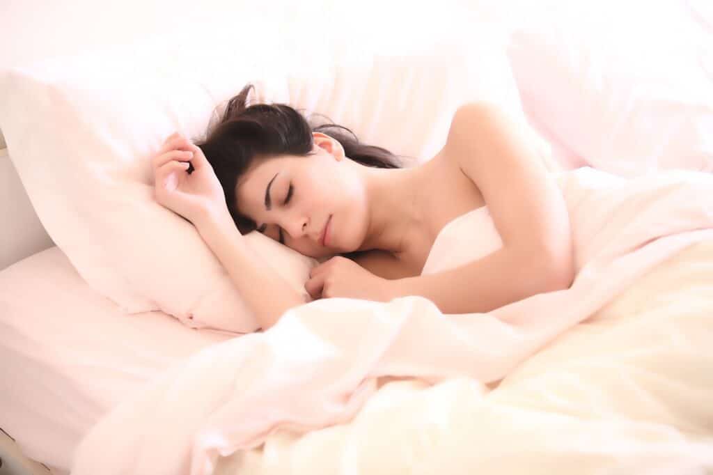Woman Sleeping Peacefully - Sleep Better with Smart Devices